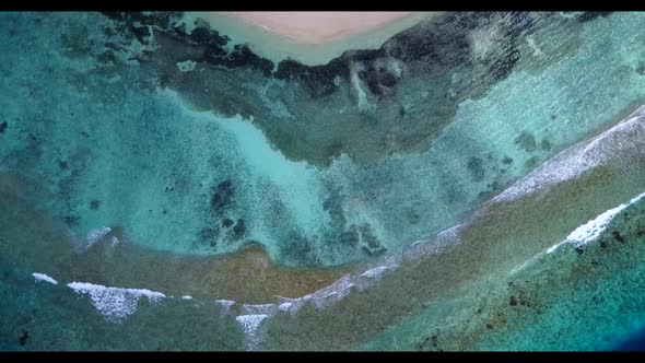 Aerial seascape of marine lagoon beach break by transparent lagoon with white sandy background of ad