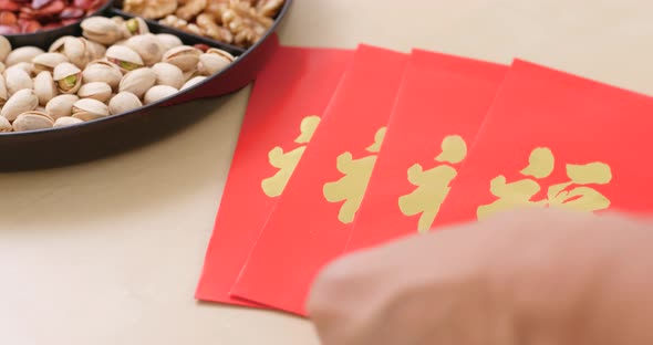 Assorted chinese new year snack tray and red pocket 