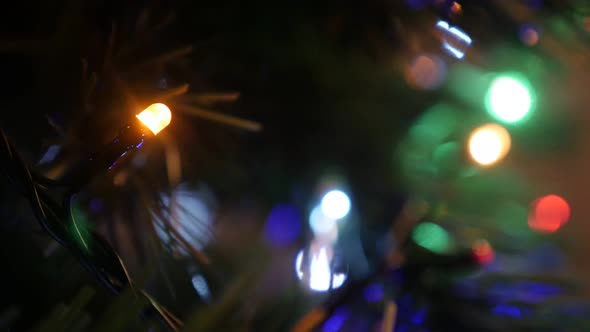 Lot of Christmas tree colorful bulbs blinking in the dark 4K 2160p 30fps UHD footage - Fairy lights 