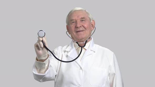 Doctor Listening To Heart with Stethoscope.