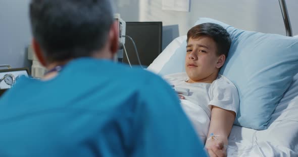 Teenager Patient Talking His Doctor in Hospital