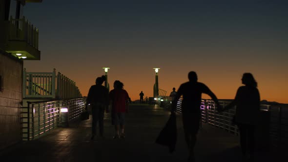 Walking on Hermosa Beach Pier, at dusk