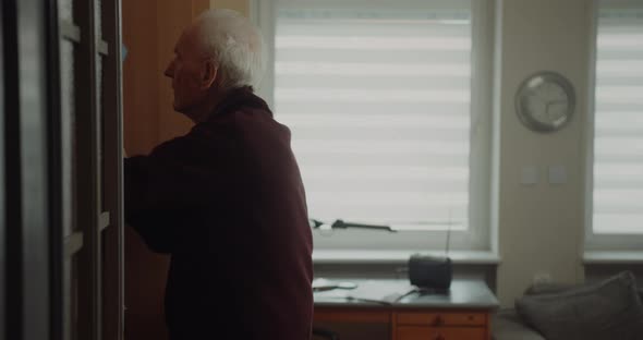 Portrait of Old Senior Man Searching Medical Pills