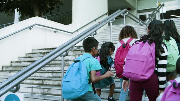 Multiethic Group of Schoolkids Going Up Stairs