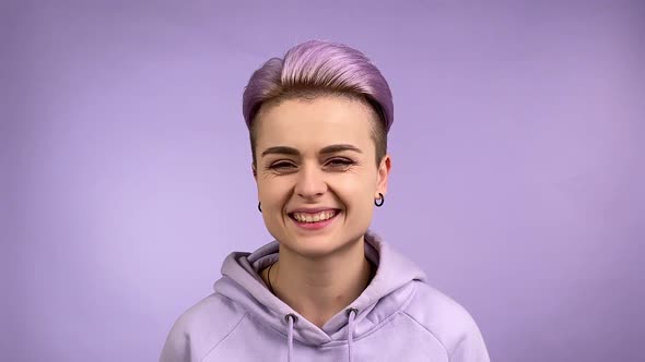 Smiling Stylish Gen z Young Adult Woman Smiling on Camera Indoors