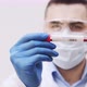 Doctor Video Footage - A Man Holding A Covid19 Positive Blood Sample - VideoHive Item for Sale