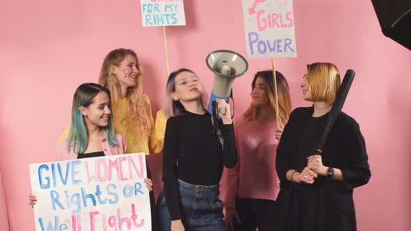 Group of Confident Girls Feminists Isolated Over Pink Background