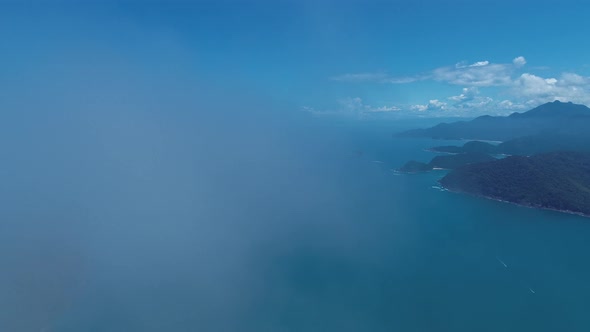 Clouds at blue sky of Paraty beach travel destination in Brazil.