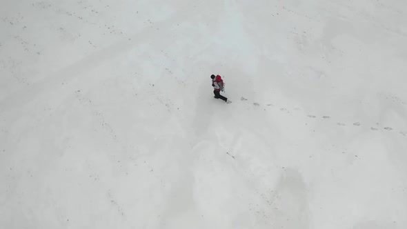 Human Walking By the Snow Field.
