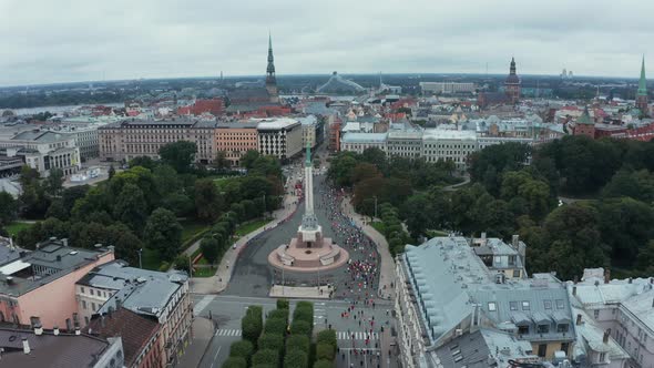 Aerial View on Crowd of People Who are Running a Marathon in Riga