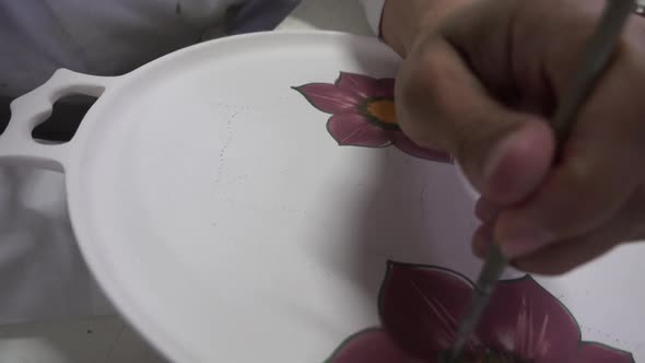 Artist Paint On Plate Flower Figure Working