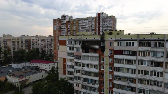 Aerial view around a old building, with burnt apartments, in a poor ghetto district of Kyiv, cloudy