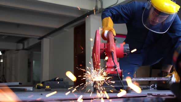Professional Mechanic is Cutting Steel Metal