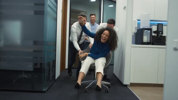 Corporate Group Having Fun Racing Office Chair