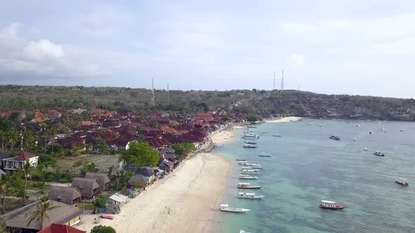 Fantastic aerial view flight slowly sinking down drone footage. Flying over frothy waves turquoise w