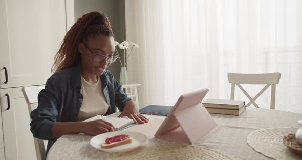 African American Woman at Start of Online Lesson