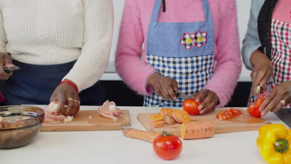 Female Hands Slicing Food Ingredients on Cutting Board