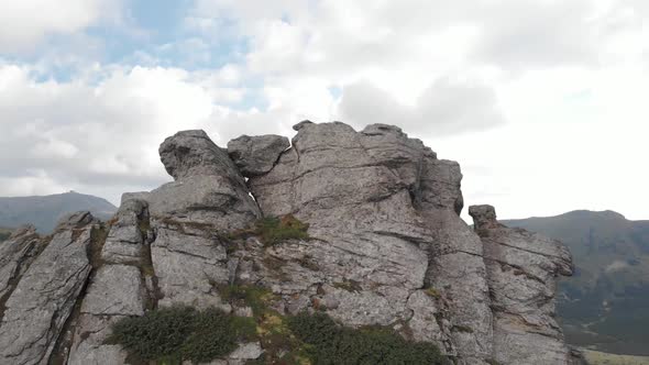 Rocky Mountain Peak Under Cloudy Sky