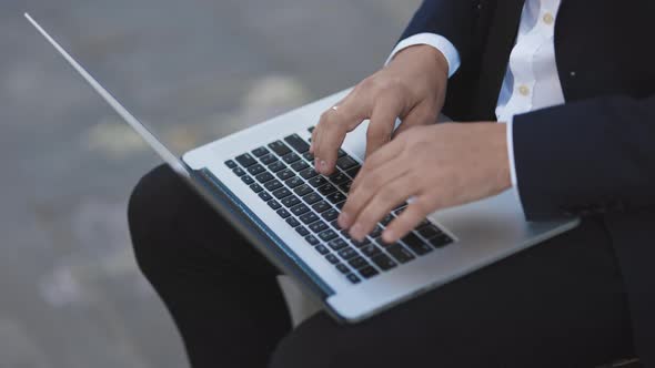 Freelancer's Hands Typing on Laptop Keyboard. Unemployment. Lack of Jobs. Financial Crisis.