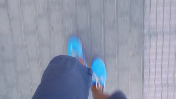 Timelapse of Male Feet Walking on Sidewalk