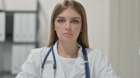 Portrait of Young Female Doctor Looking at Camera 