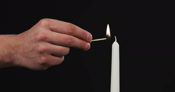 Hand firing a candle