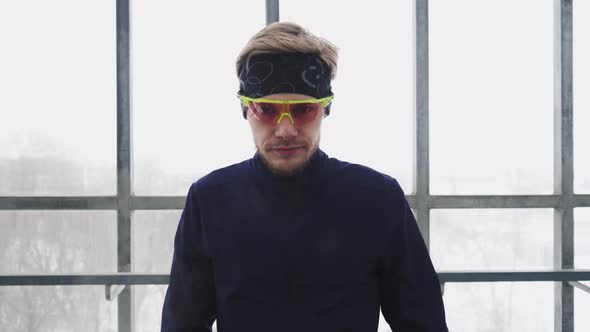 Running Man In Sportswear Workout Before Triathlon Sprinting In Glass Tunnel