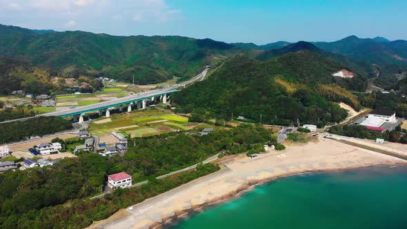 small village between the beach and a highway on shikoku, japan
