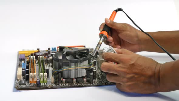 Repair Computer Mainboard By Using A Hand Tool Used In Soldering