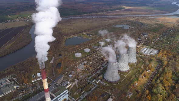 State District Power Station Generating Heat and Electricity. High Pipes and Cooling Towers Are