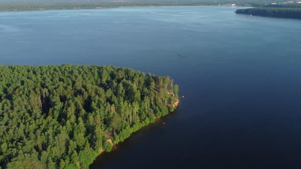 Aerial View Of Summer River Landscape And Small Village In Sunny Summer Evening