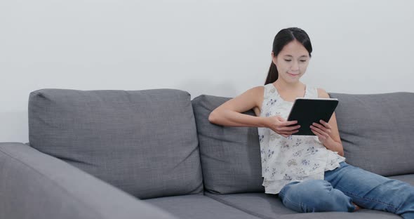 Woman use of tablet computer at home