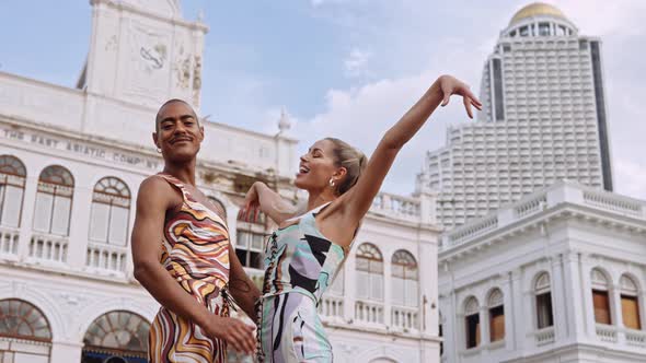 Fashion Models Posing Together In Bright Clothing