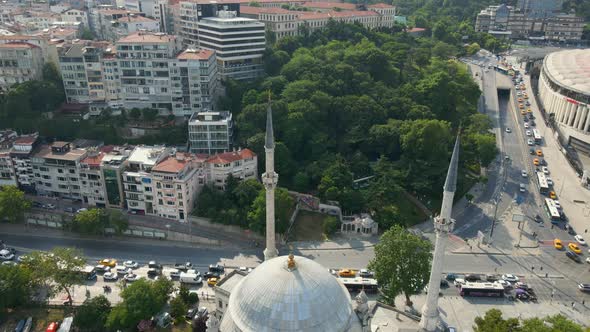 Flying over Dolmabache Mosque toward city of Istanbul