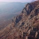Aerial View of a Drone Flying Over Sharp Rocky Outcrops at Sunset - VideoHive Item for Sale
