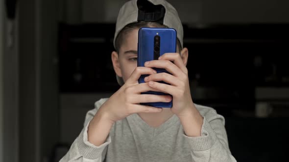 Teenager Who Spends Most of His Time with a Mobile Phone