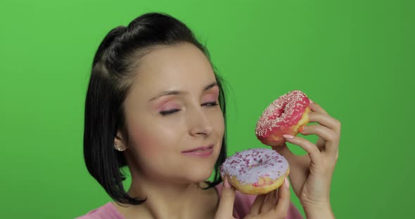 Happy Beautiful Young Girl Posing and Having Fun with Donuts. Chroma Key