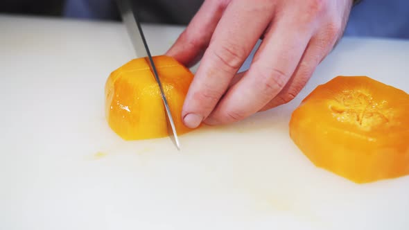 cutting persimmons with a table knife