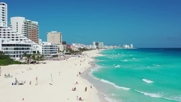 Beautiful white sandy beach at water's edge in Cancun