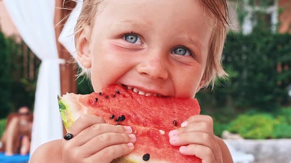 Happy Child with Big Red Slice of Watermelon