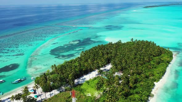 Aerial top down landscape of exotic island beach lifestyle by blue sea and white sandy background of