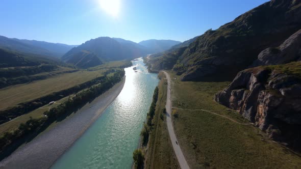 Aerial Sunny Panorama View Automobile Traffic Riding Dirt Road Near River Sand Ground Dust