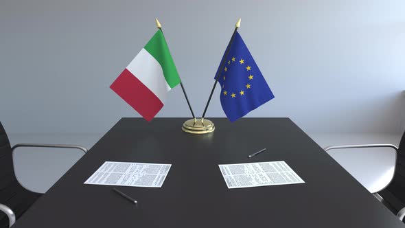 Flags of Italy and the European Union on the Table alt