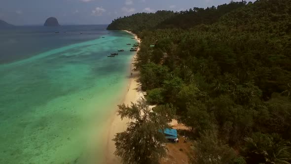 Aerial view of two traditional long tail boat moored in Chao Mai National Park in Thailand.