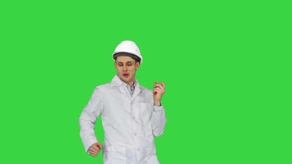 Engineer Man Dancing Hip-hop in Funny Way on a Green Screen, Chroma Key.