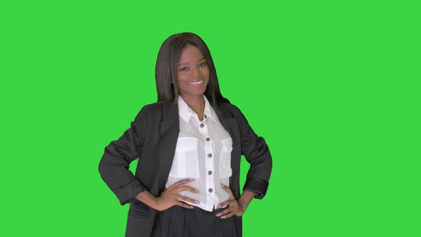 Pretty African American Business Woman Smiling on a Green Screen, Chroma Key