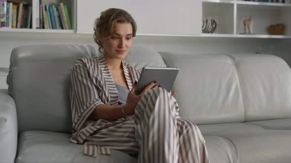 Woman Surfing Internet Online at Home Interior