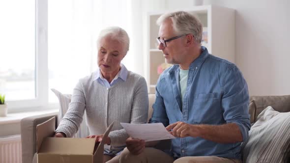 Senior Couple with Parcel and Delivery Note 92