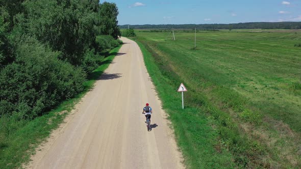 Active Man on Bicycle Rides in Nature Nature