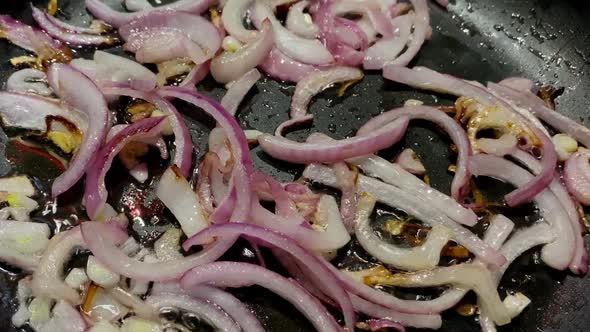 Preparation Chopped Fried Onion in Frying Pan in Domestic Kitchen for Cooking Food on Kitchen Stove